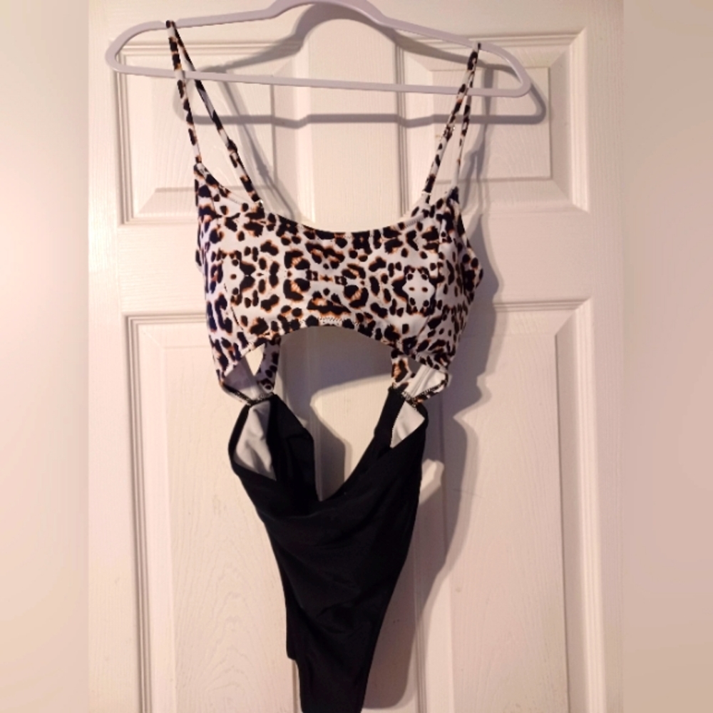 One-piece cheetah print swimsuit with cutouts